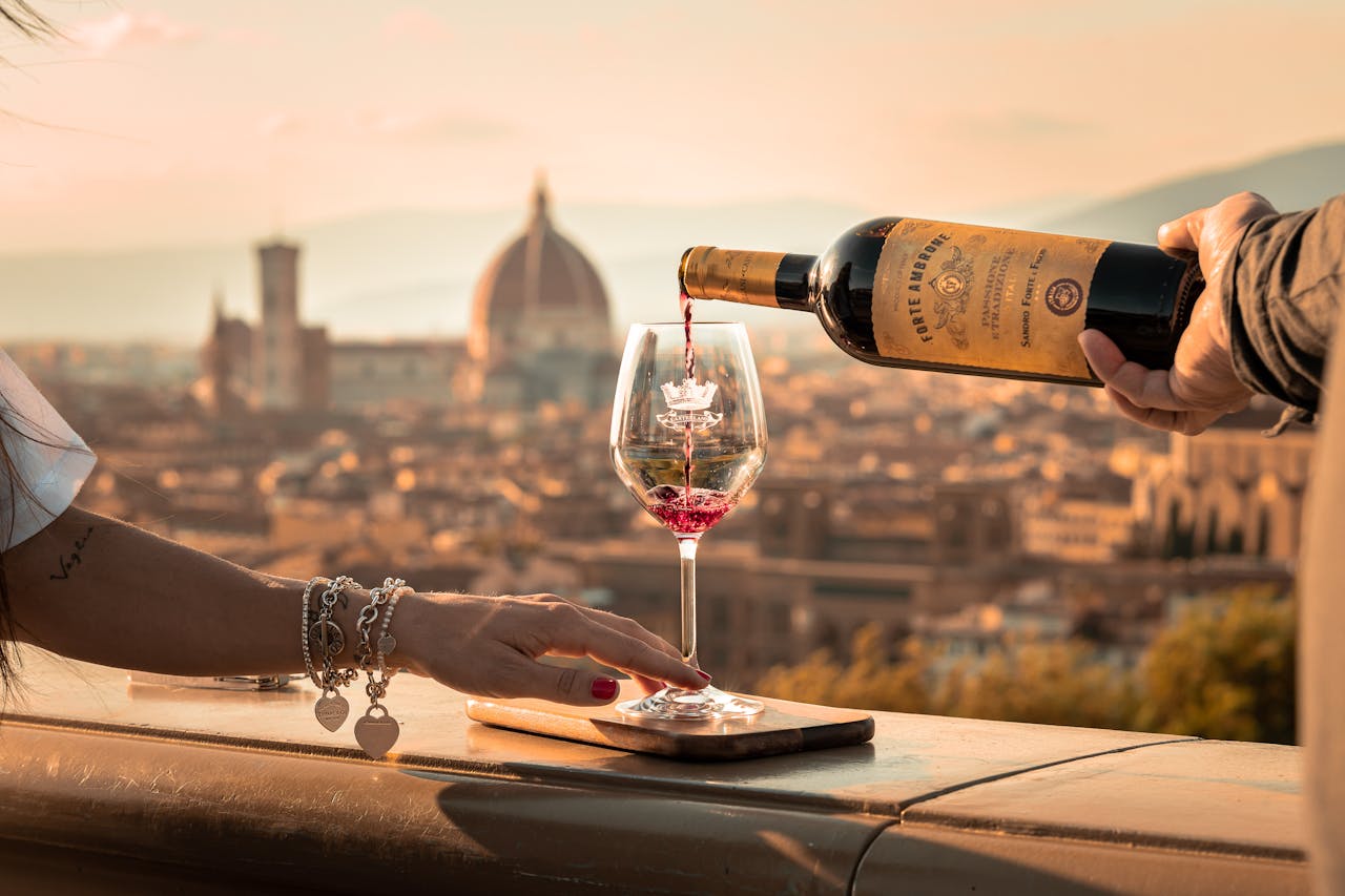 Elegant wine pouring scene with Florence's iconic skyline and cathedral in the backdrop.