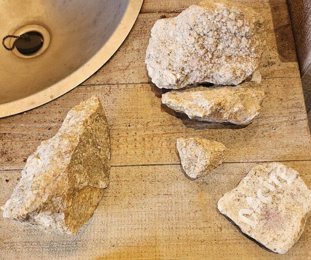 Wine Tasting in Côtes du Forez, France Stones of volcanic granite soil in the vineyard